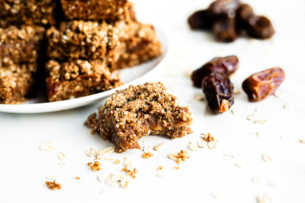A chewy date bar with a bite taken out