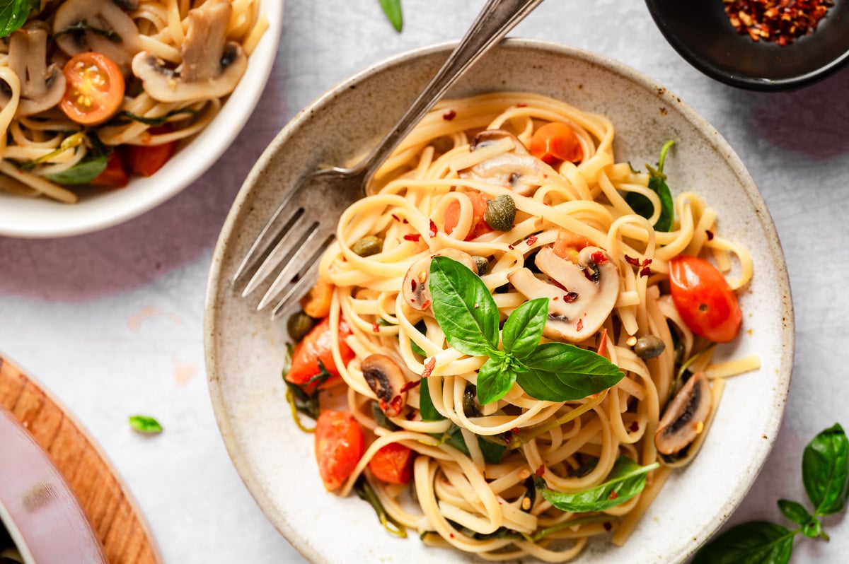 Delicious vegan pasta topped with basil