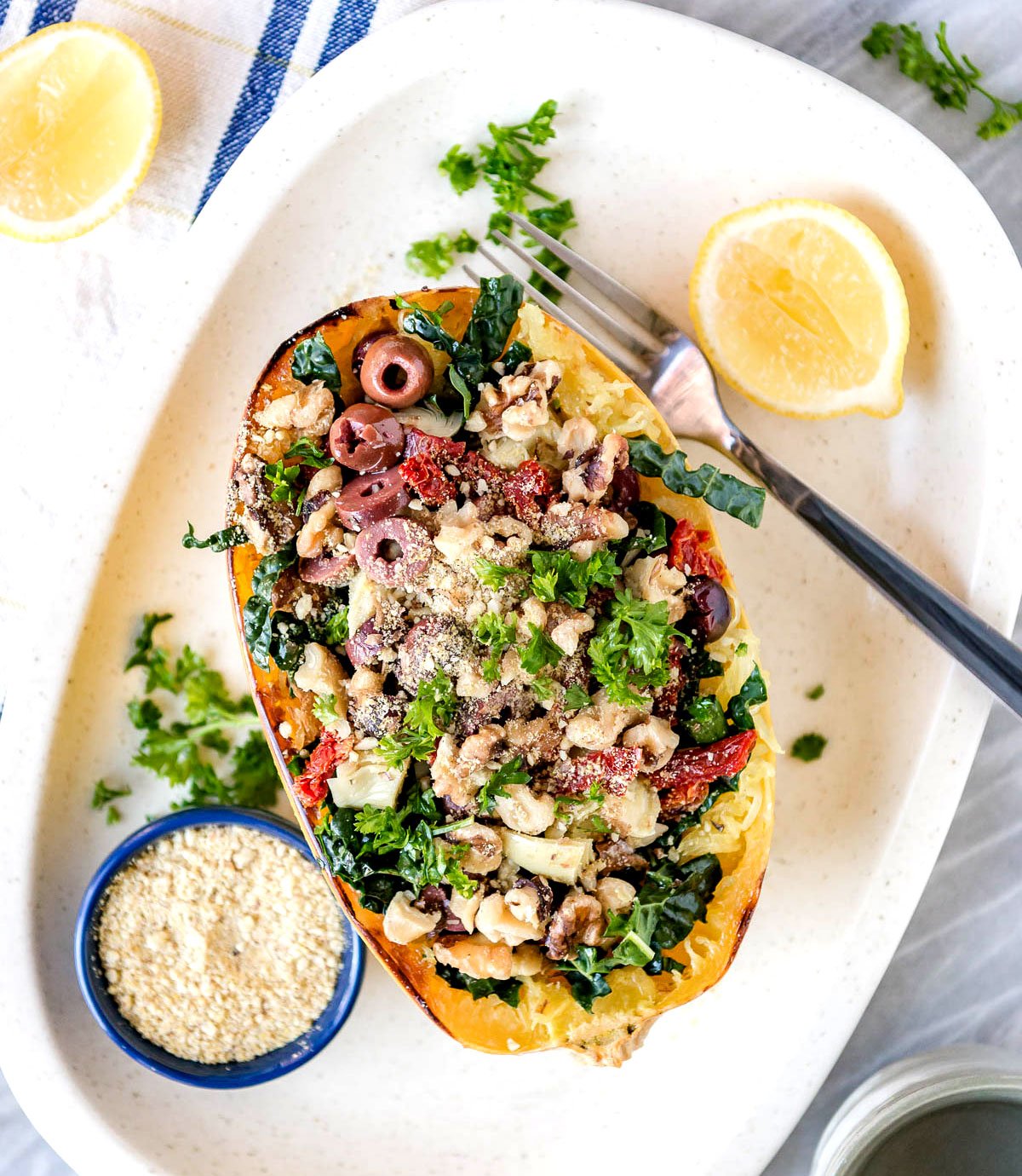 Baked spaghetti squash with Kalamata olives, kale and walnuts