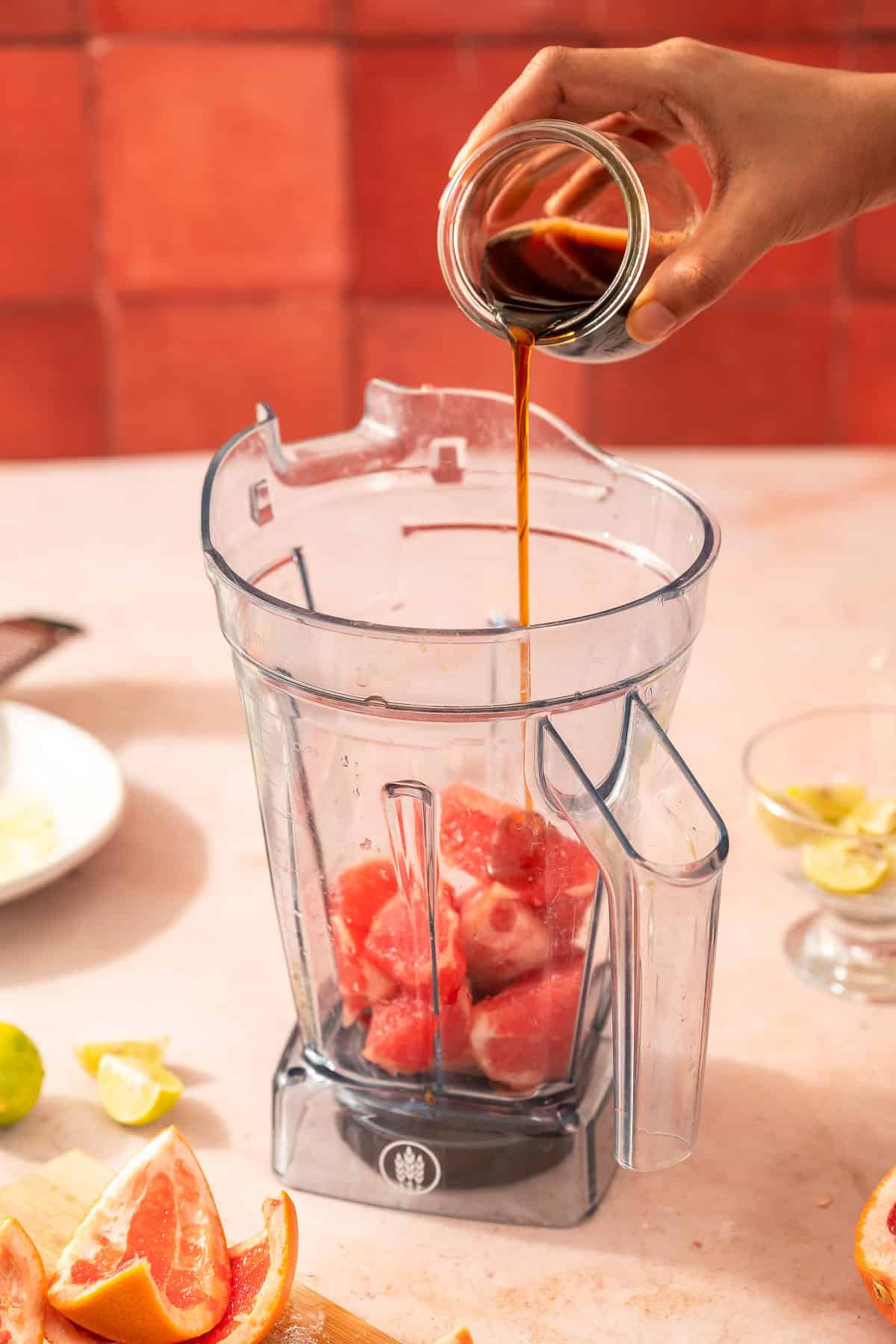 Adding maple syrup into the blender