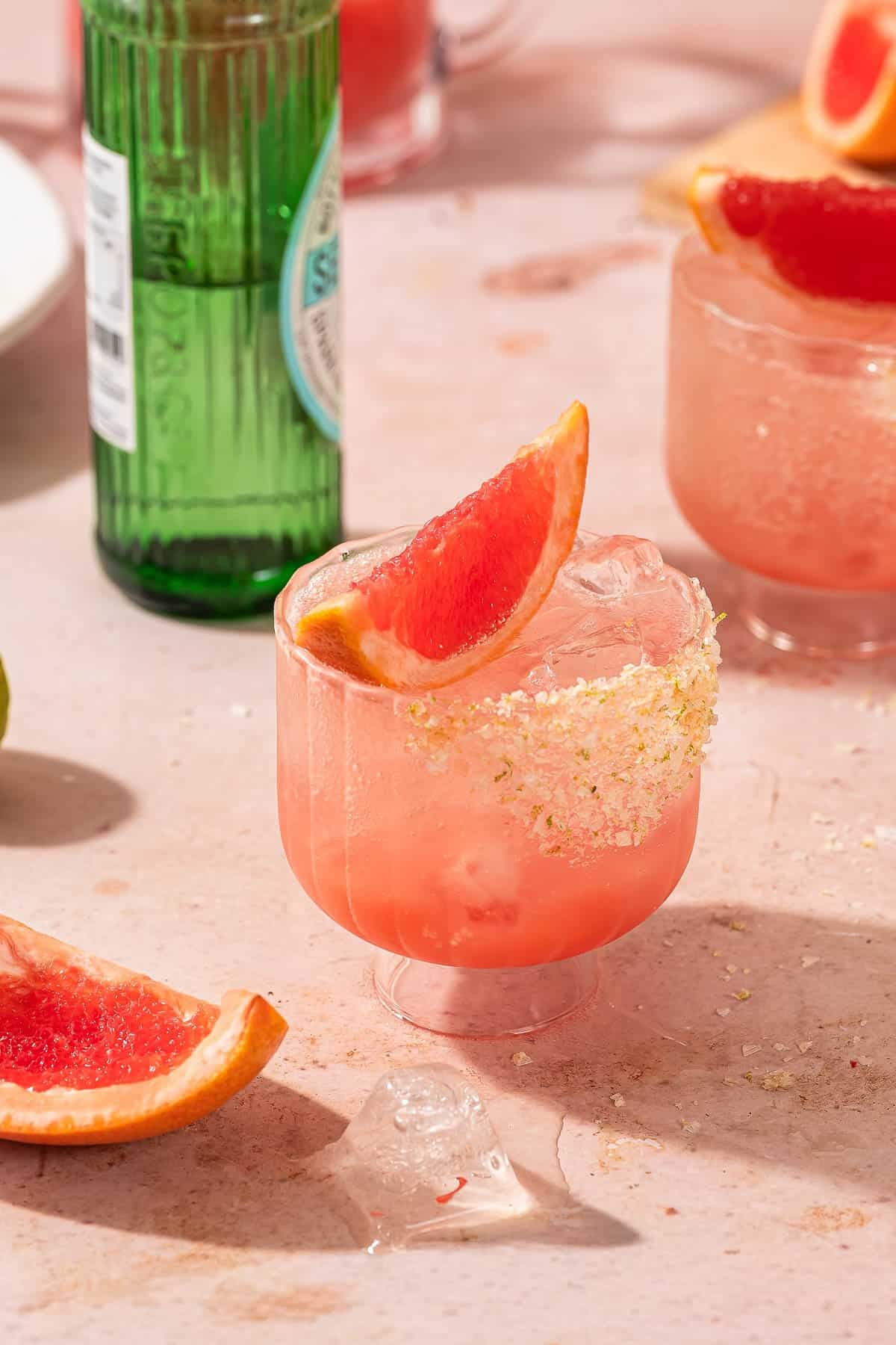 Chilled paloma mocktail with a sliced grapefruit on top