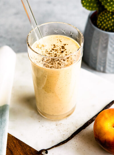 Tall glass of vanilla peach yogurt smoothie