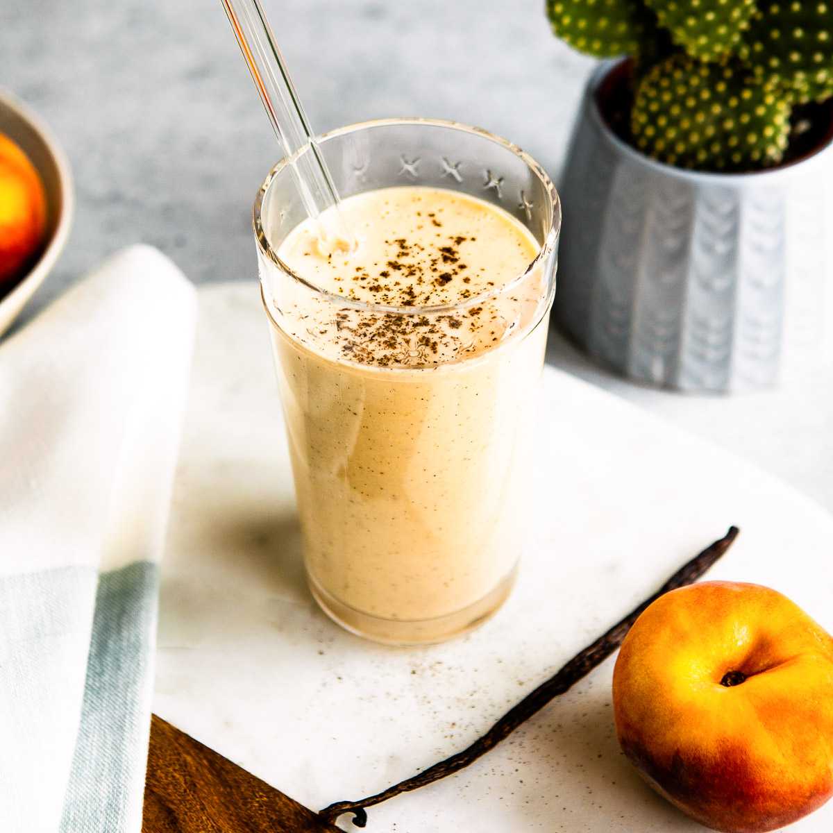 Tall glass of vanilla peach yogurt smoothie