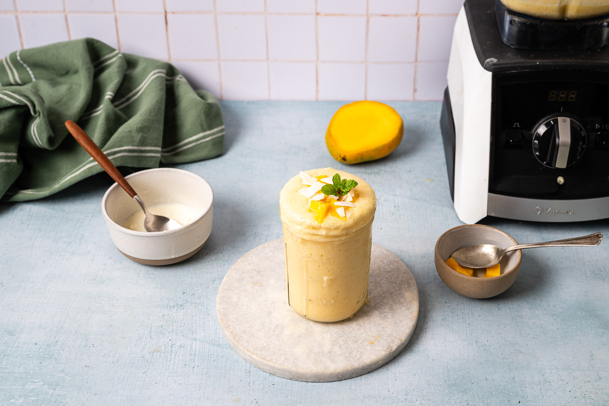 A glass of thick and creamy pineapple cottage cheese smoothie