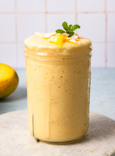 A glass of pineapple cottage cheese smoothie