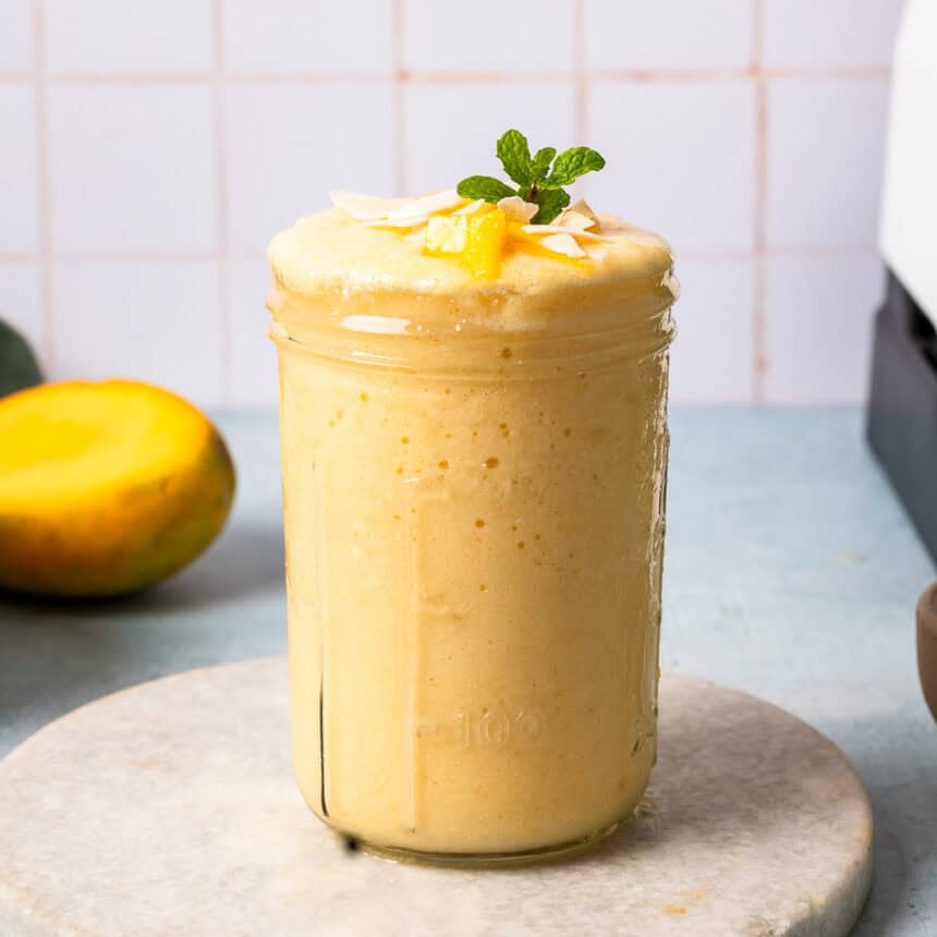 A glass of pineapple cottage cheese smoothie