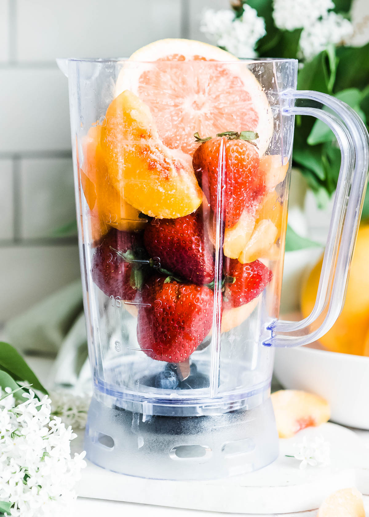 Fresh and frozen fruits added in a high-speed blender