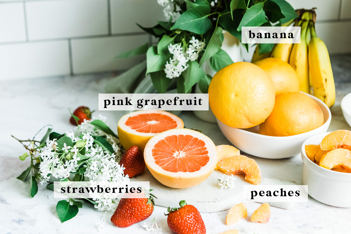 Labeled ingredients for making a pink grapefruit smoothie.