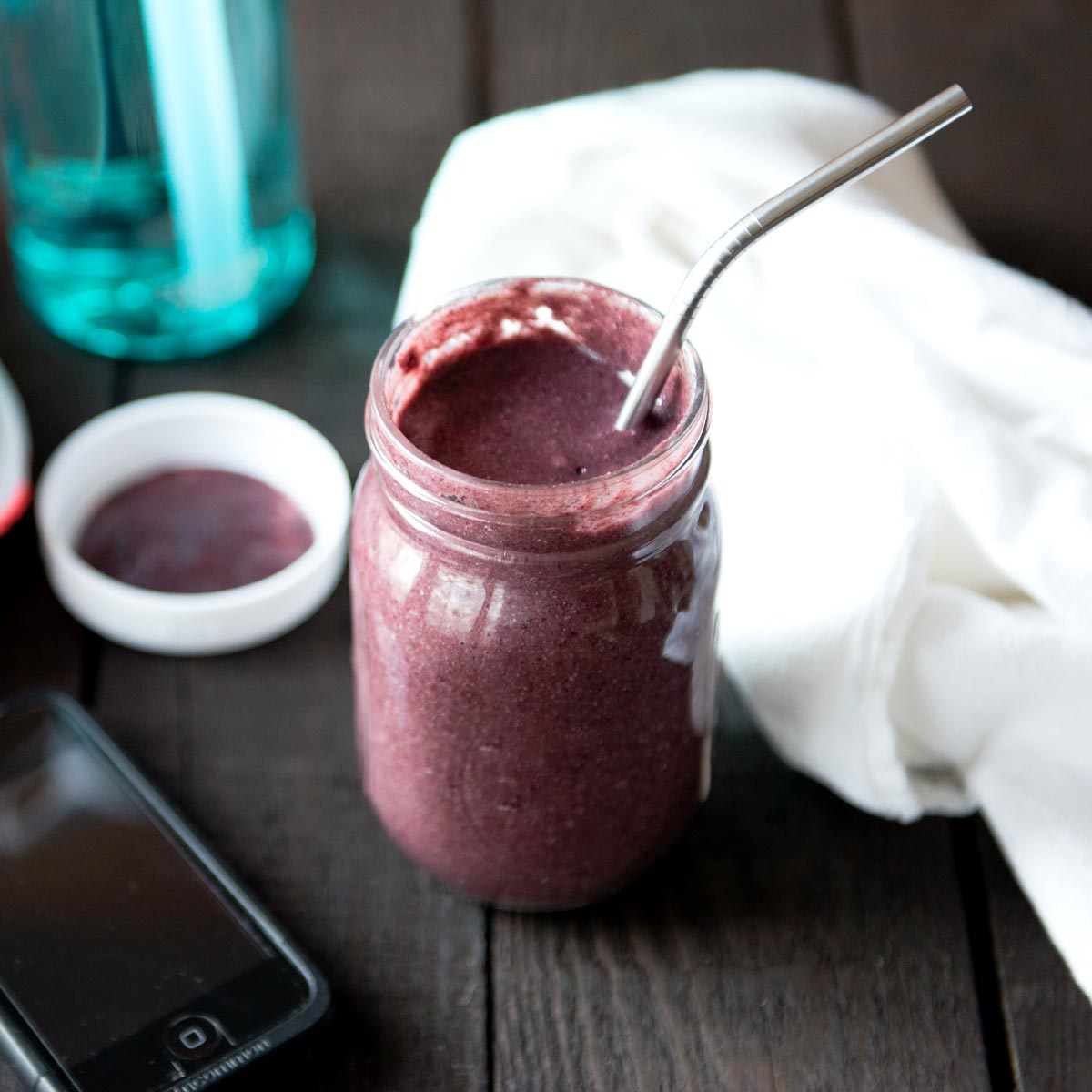 Metal straw in a jar of post workout smoothie.