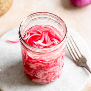 Quick pickled red onions in a mason jar