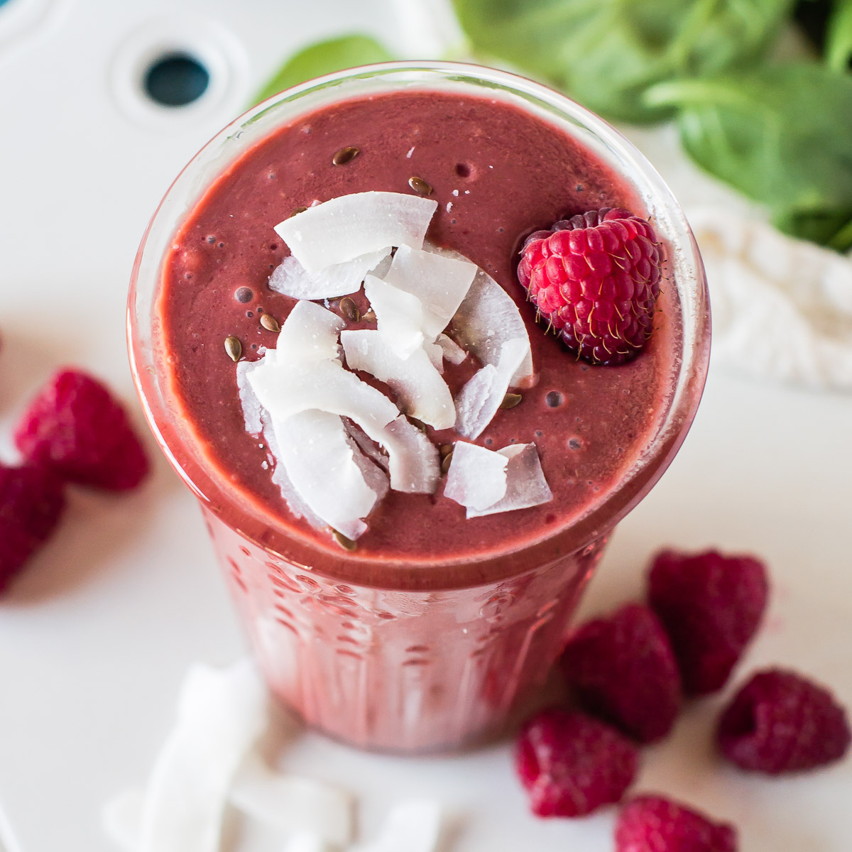 Raspberry smoothie with shredded coconut on top