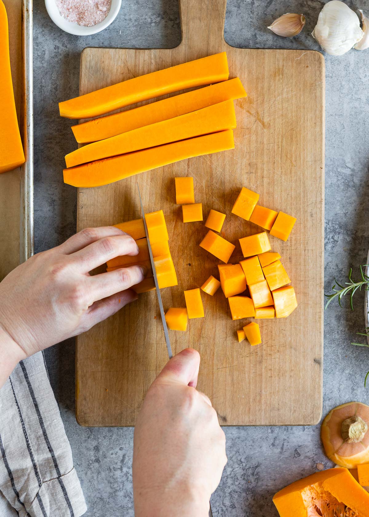 Dicing butternut squash into small cubes