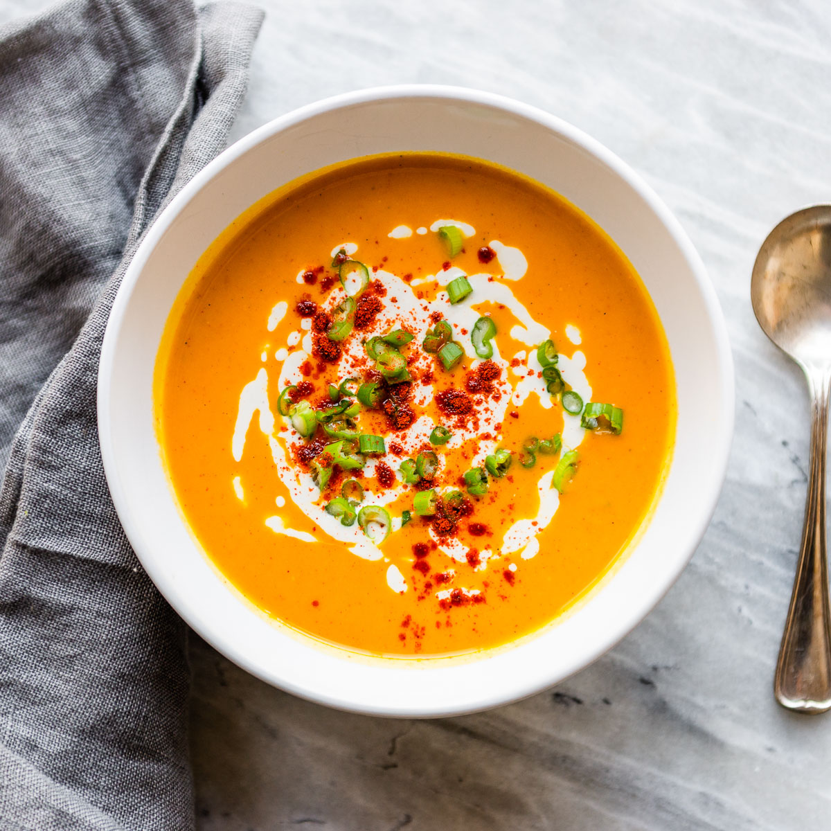 Creamy roasted red pepper soup in a bowl