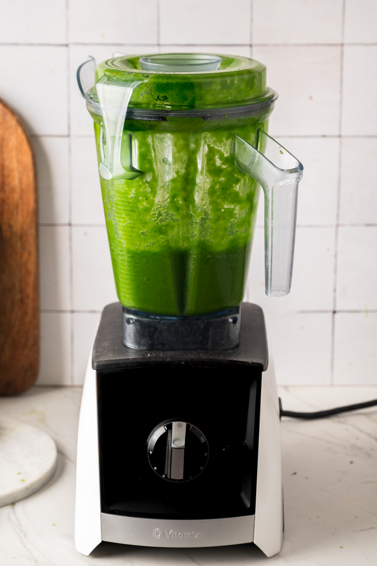 Green juice recipe blending in a blender