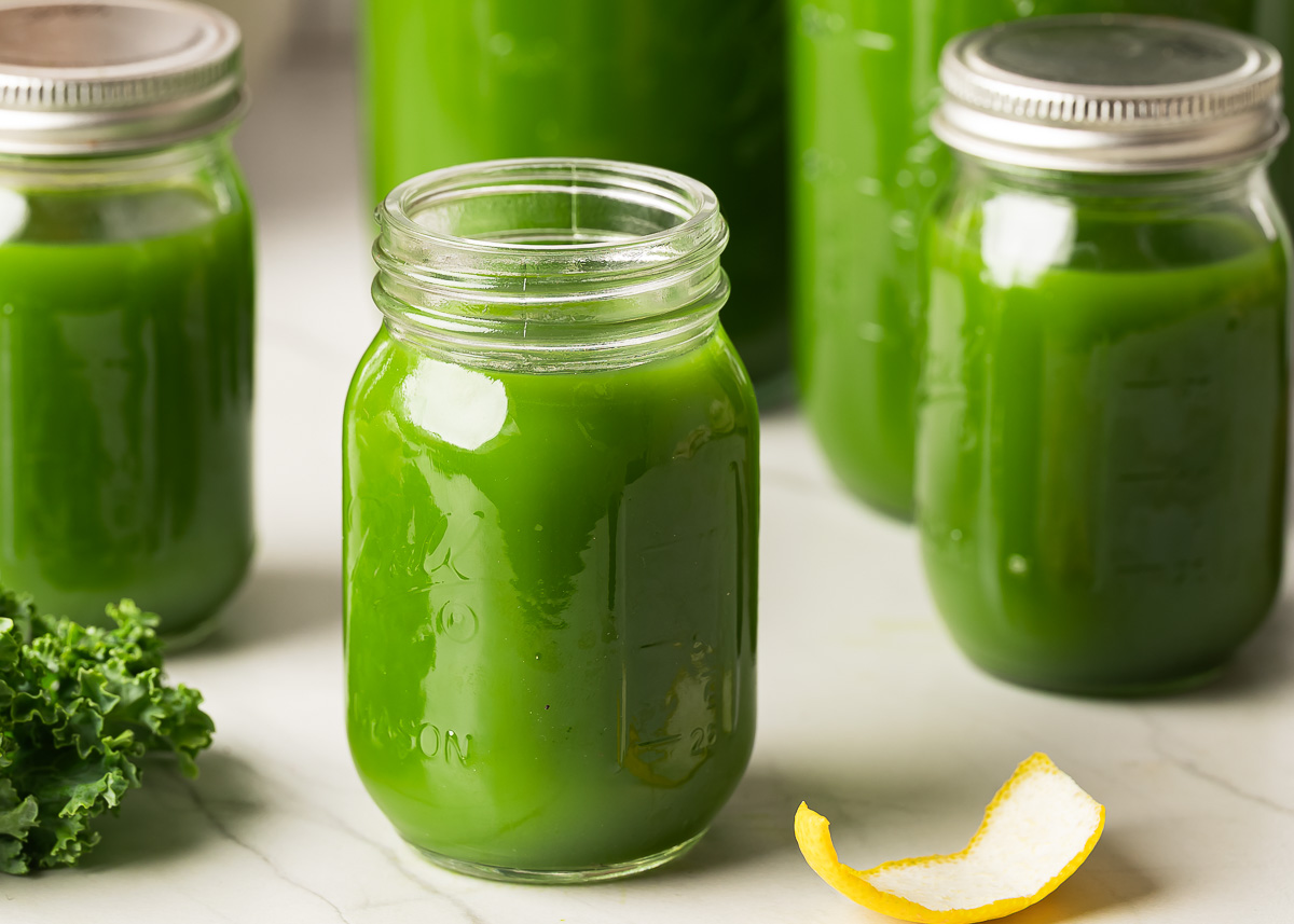 Glass jars containing freshly made green juice