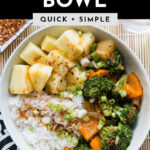 teriyaki rice bowl with pineapple, broccoli and carrots in a white bowl.