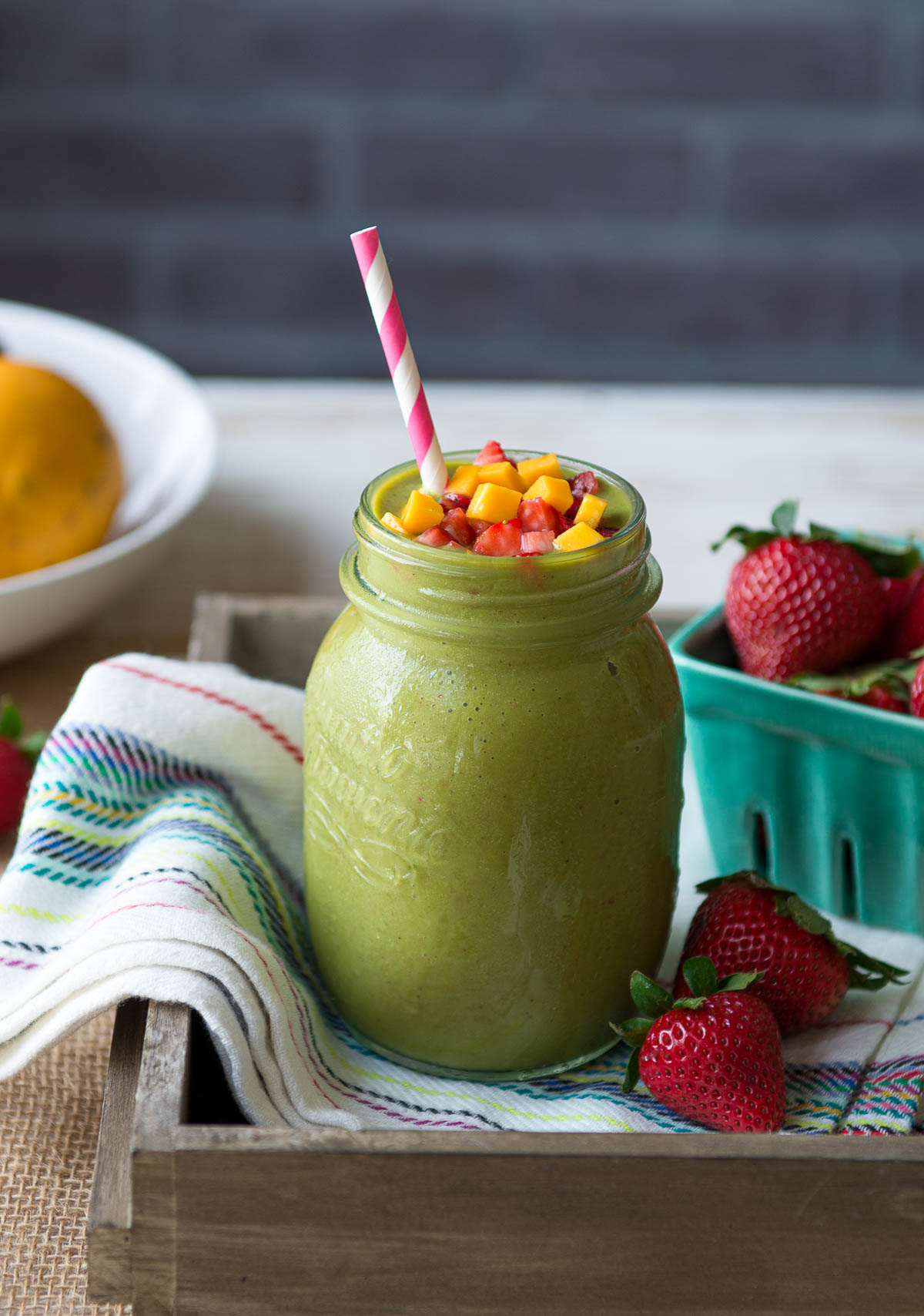 The best strawberry mango smoothie recipe topped with fresh mango and strawberry cubes.