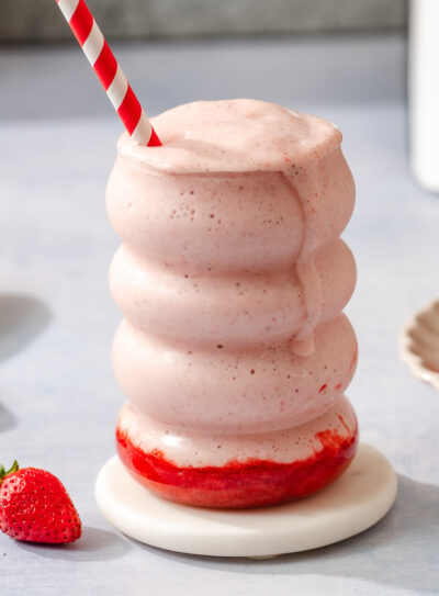 A glass of strawberry protein shake