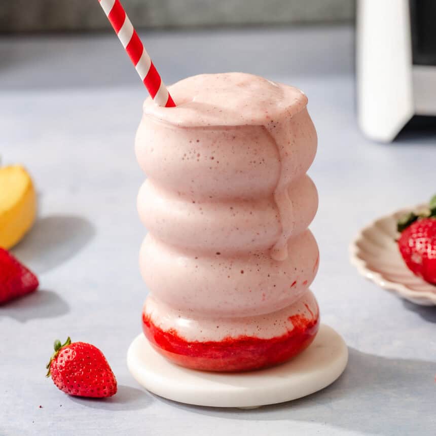 A glass of strawberry protein shake