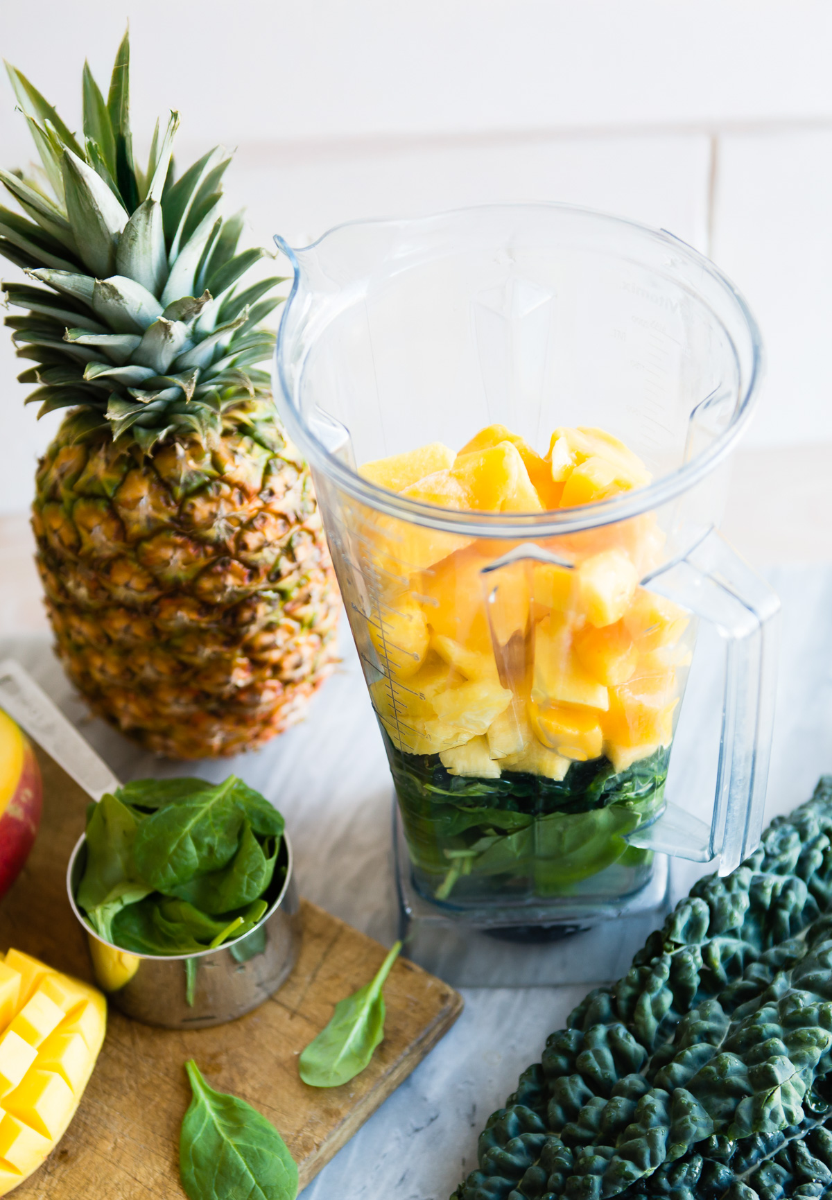 Ingredients for creating tropical detox movie inside a blender.