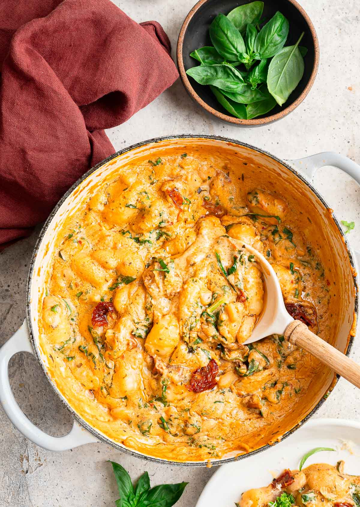 A warm skillet of Tuscan vegan gnocchi ready to be served