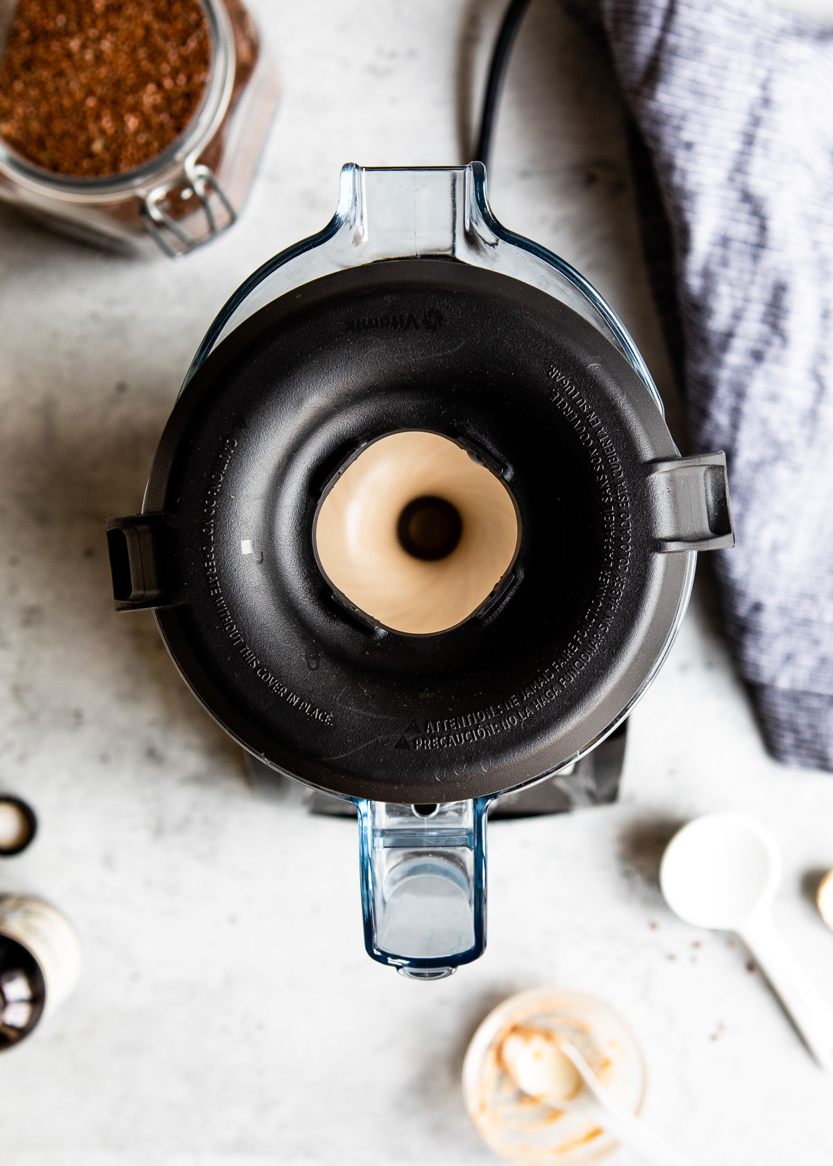 Vanilla flaxseed smoothie blending in a blender