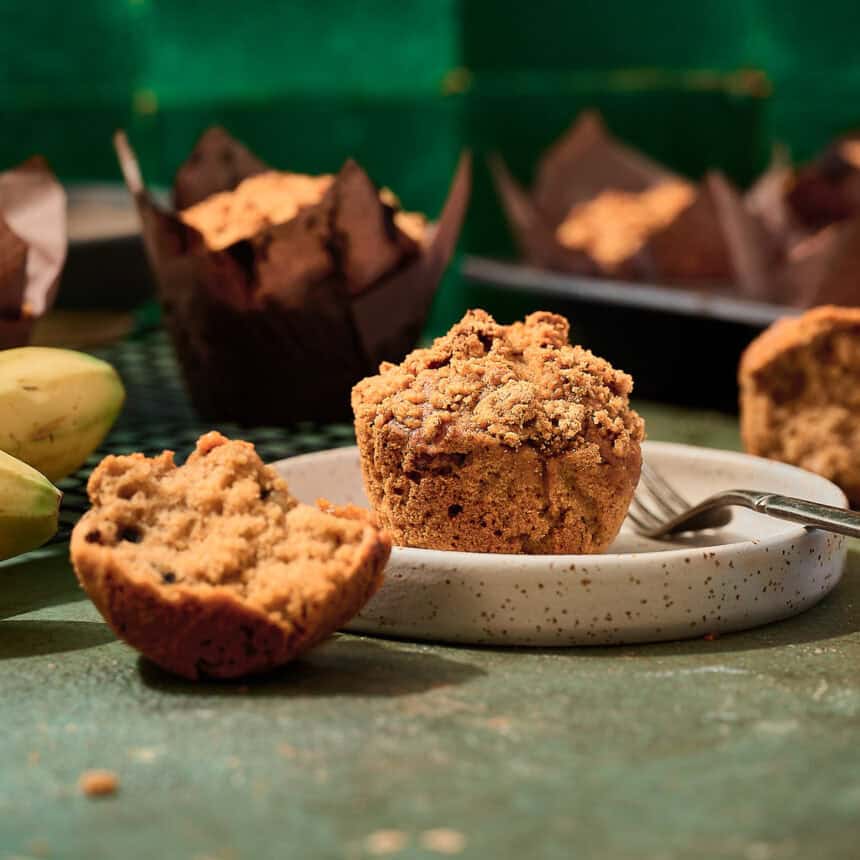 Fluffy vegan banana muffin on a ceramic plate