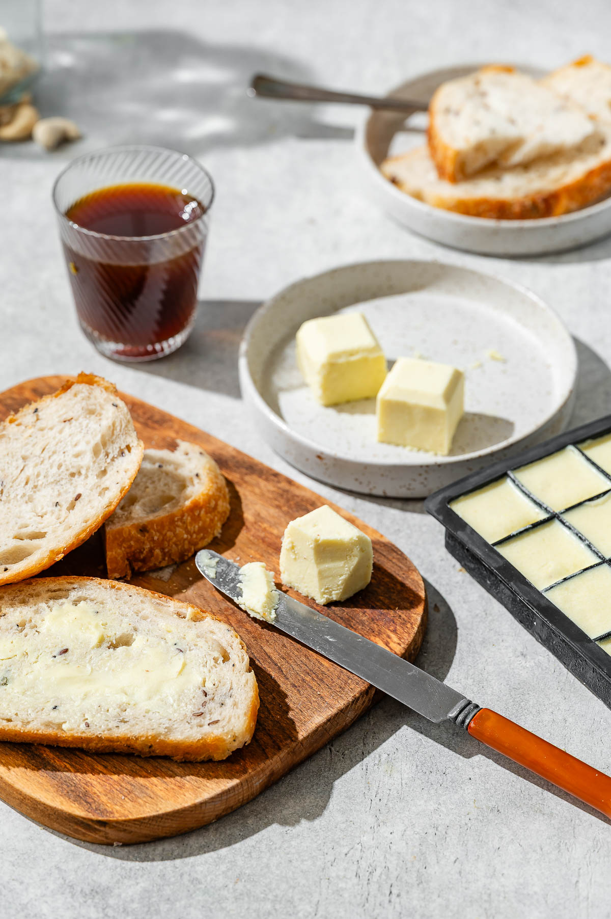 Slices of crusty bread with vegan butter spread on top