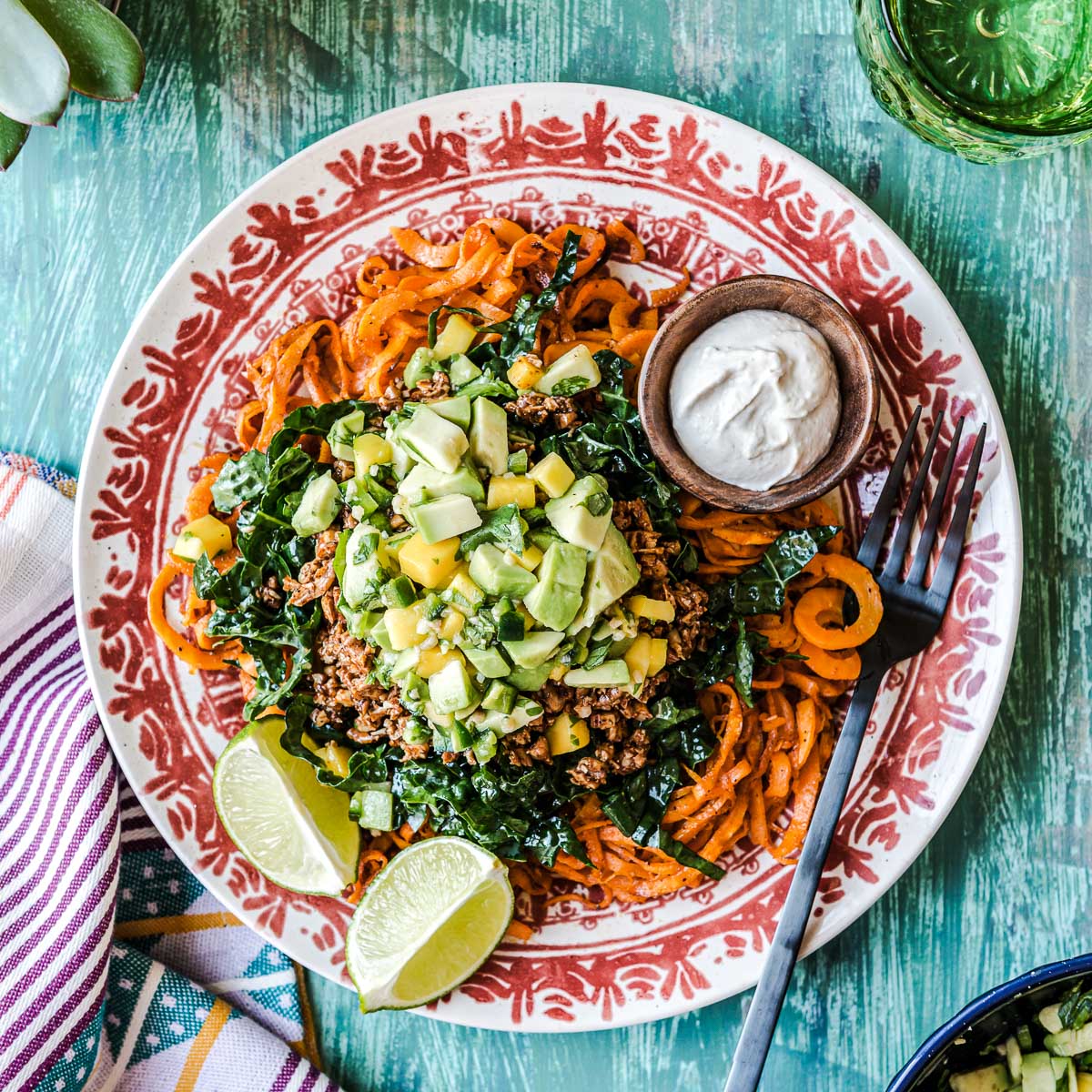 Vegetarian taco salad on a brightly decorated plate.