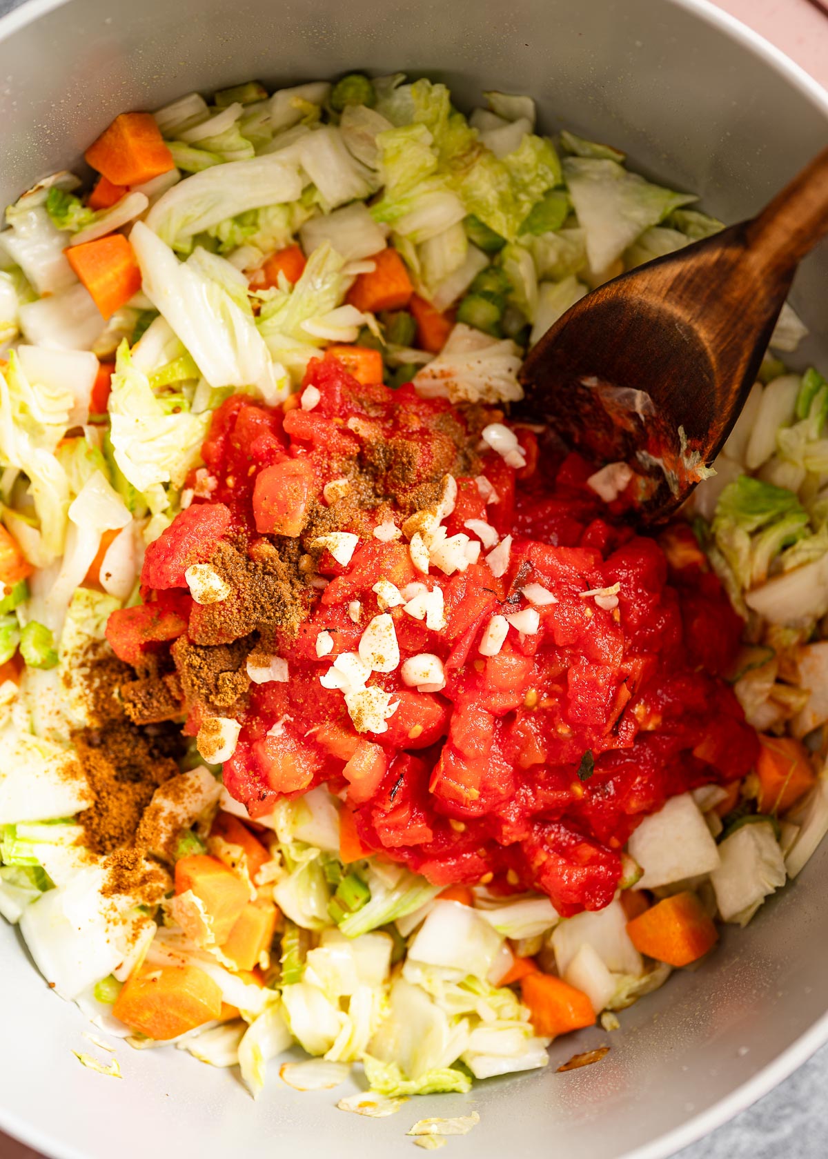 Roasted tomatoes and spices over chopped vegetables