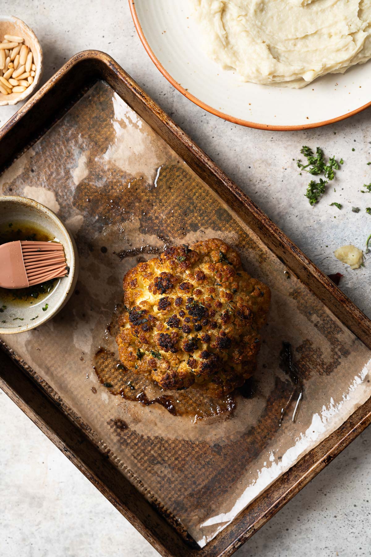 A freshly out of the oven roasted whole head of cauliflower