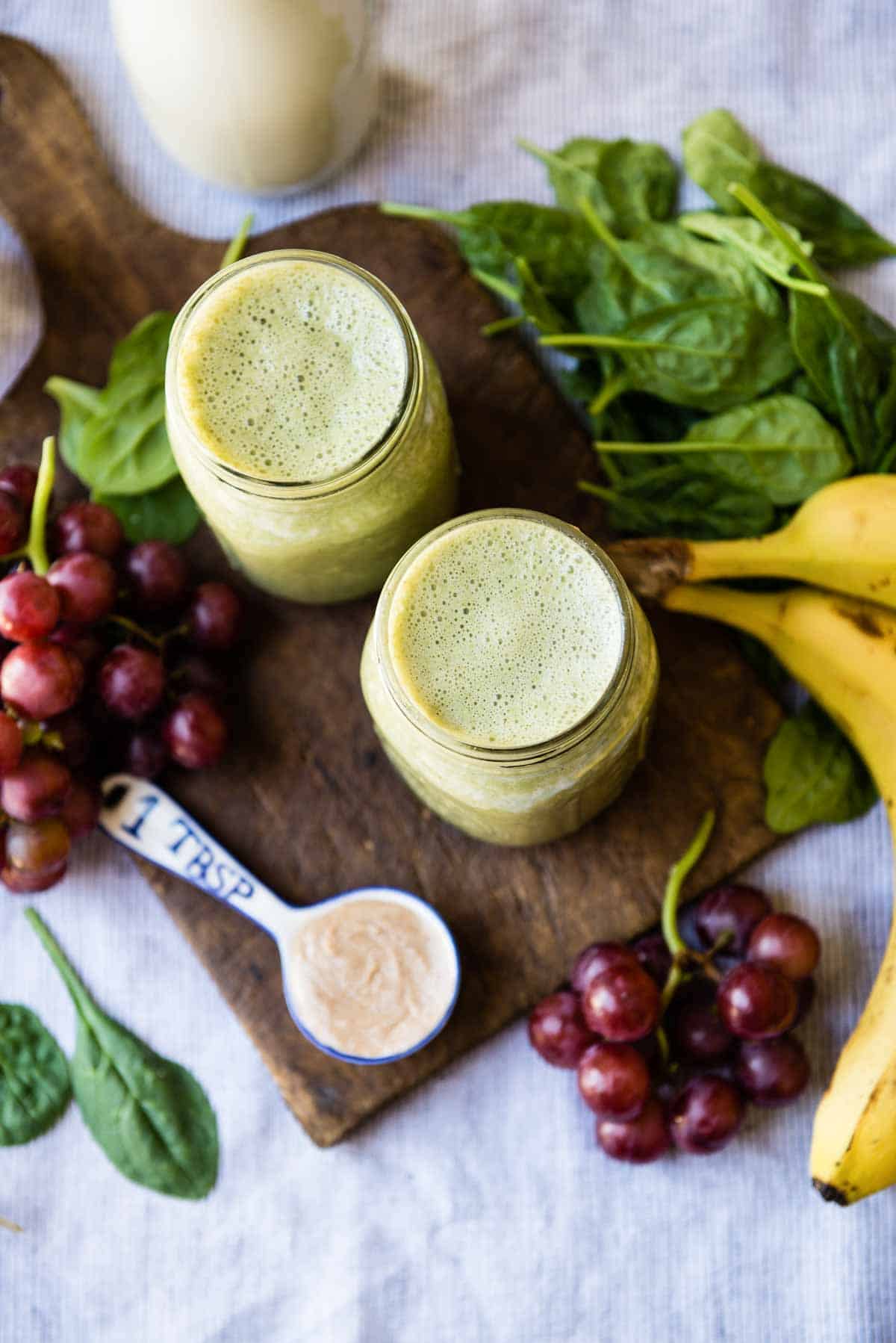 Blended almond butter green smoothie with banana