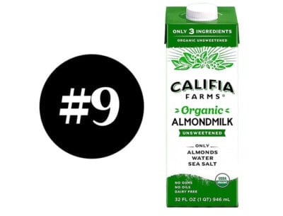 Organic almond milk carton with green label and white cap.