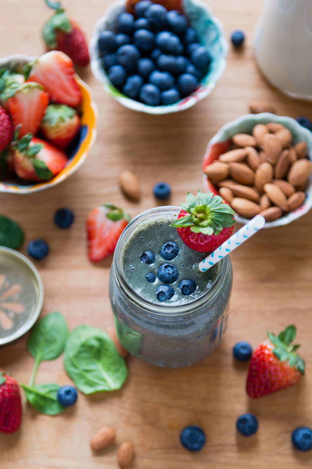 Mason glass jar of berry almond milk smoothie