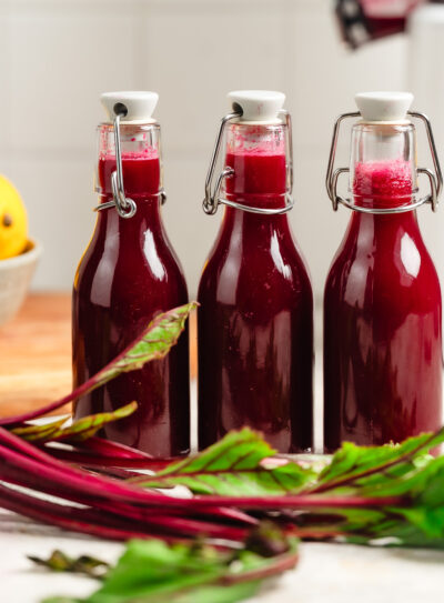 Three bottles of apple beet juice