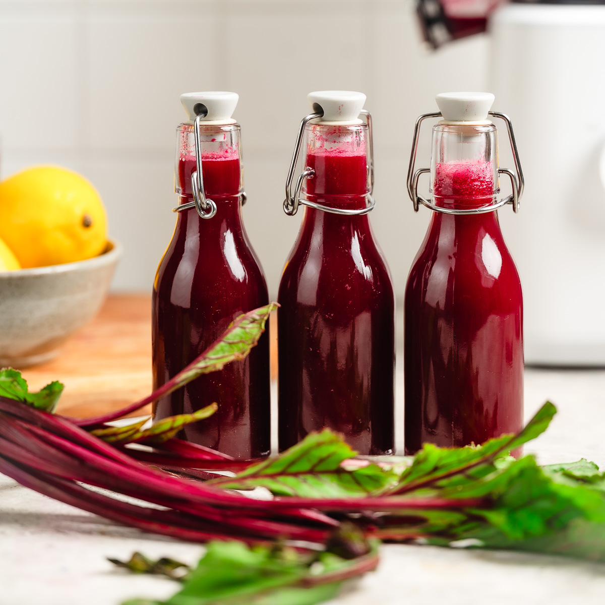 Three bottles of apple beet juice