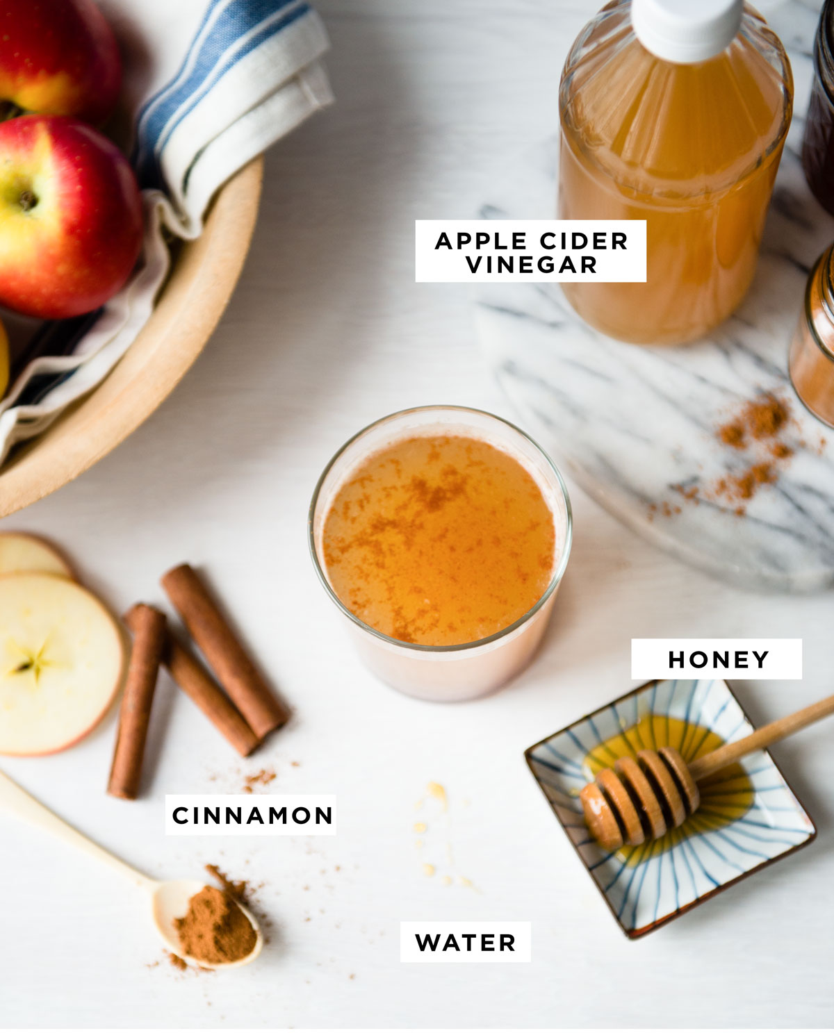 labeled ingredients including apple cider vinegar, honey, cinnamon and water.