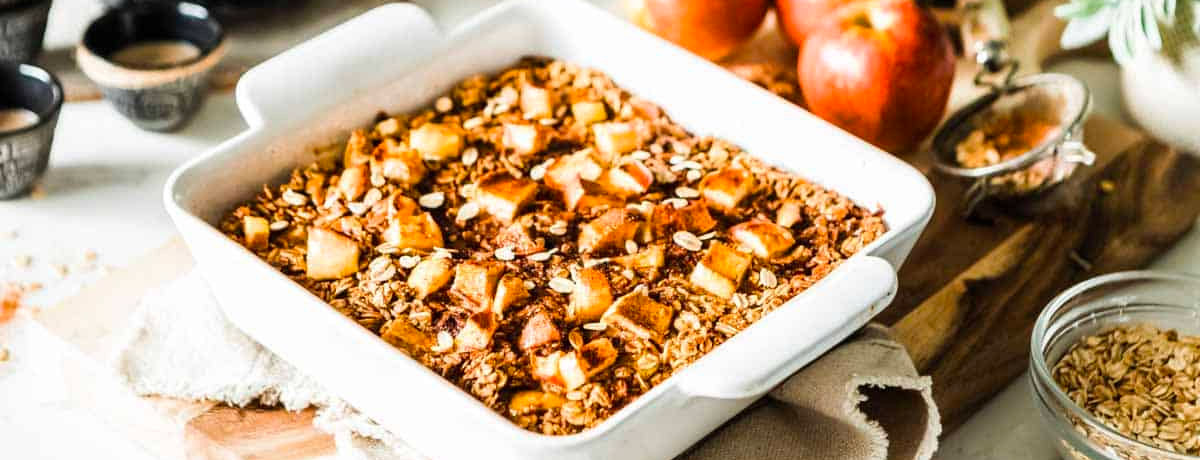 pan of baked oatmeal with apple cubes on top