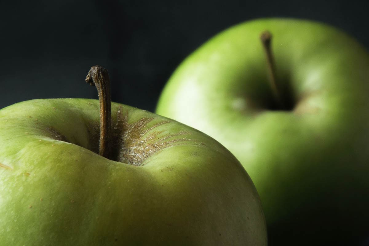 close up photo of 2 fresh green apples
