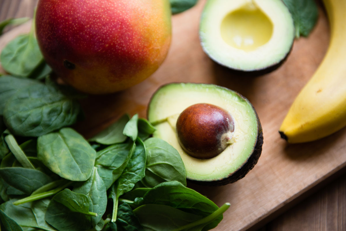 Close up of avocado cut in half. 