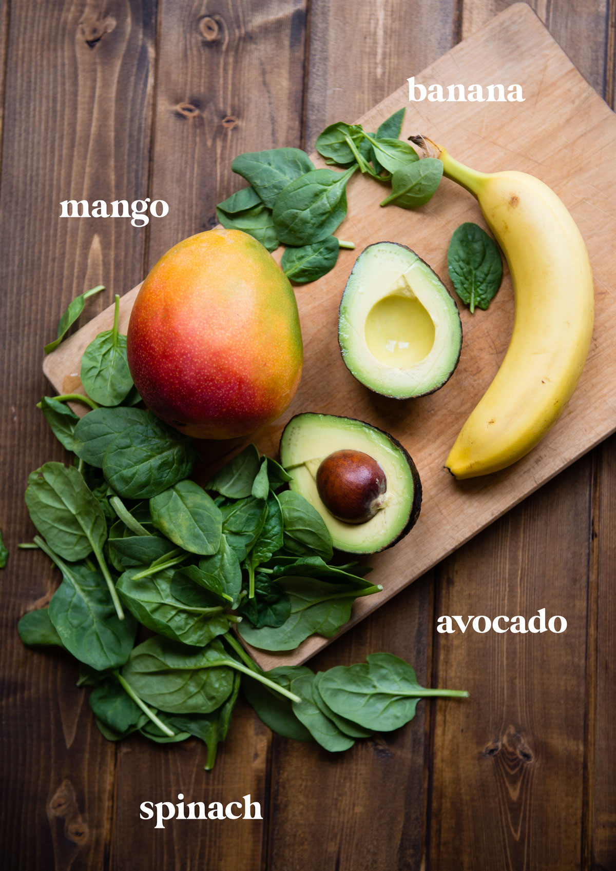 Avocado banana smoothie recipe ingredients on a table.