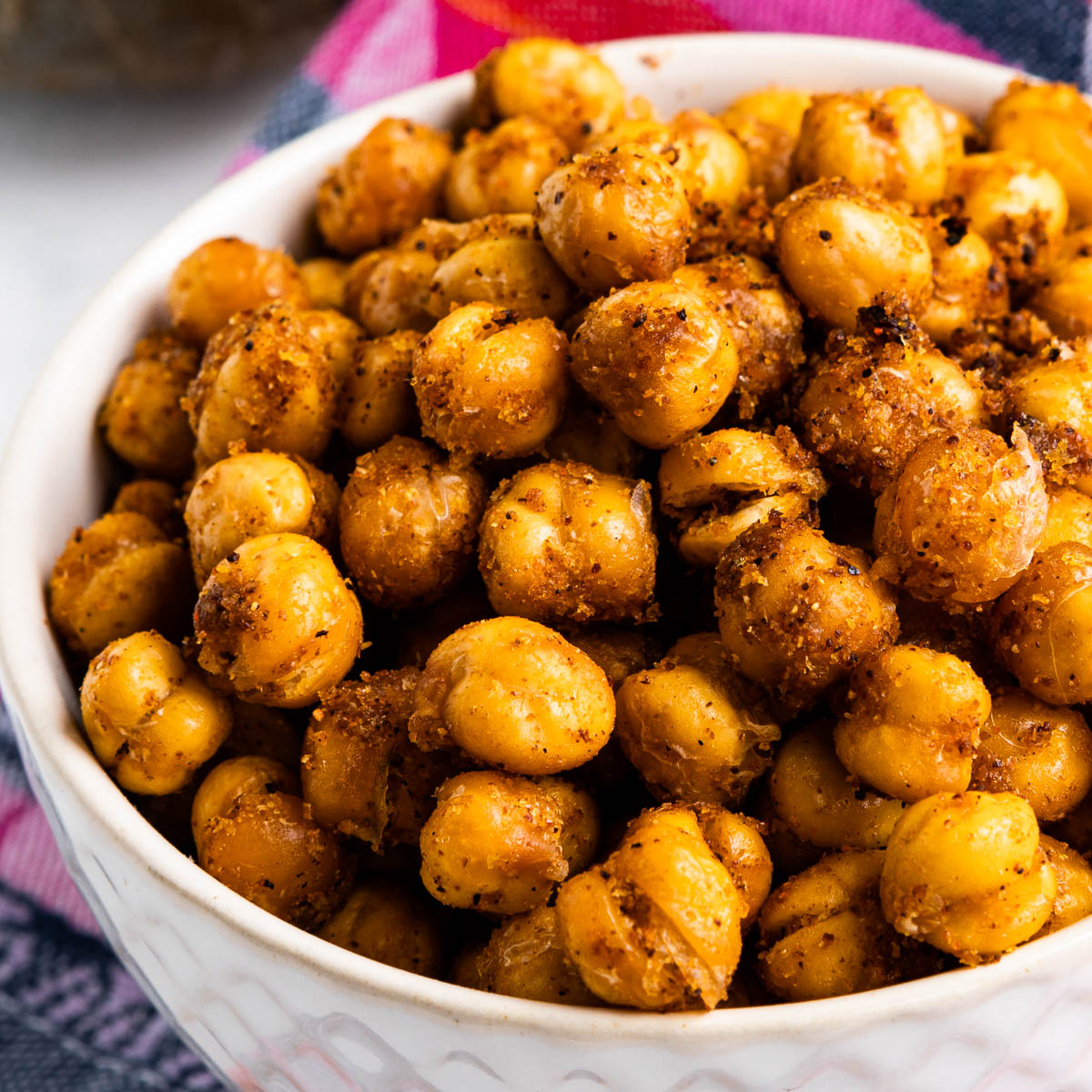 Bowl piled with garlic baked chickpeas.