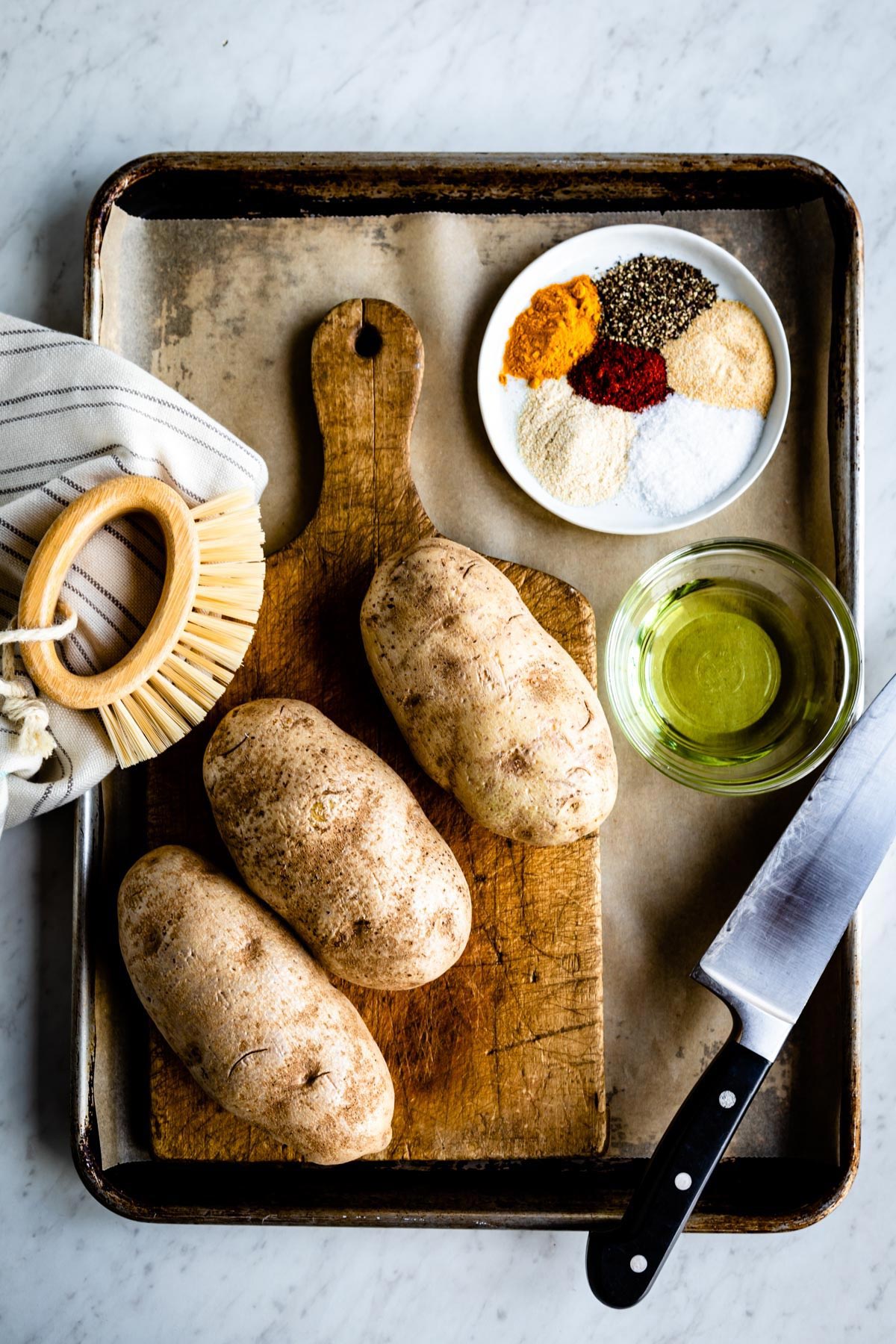 Ingredients for making baked potato wedges.