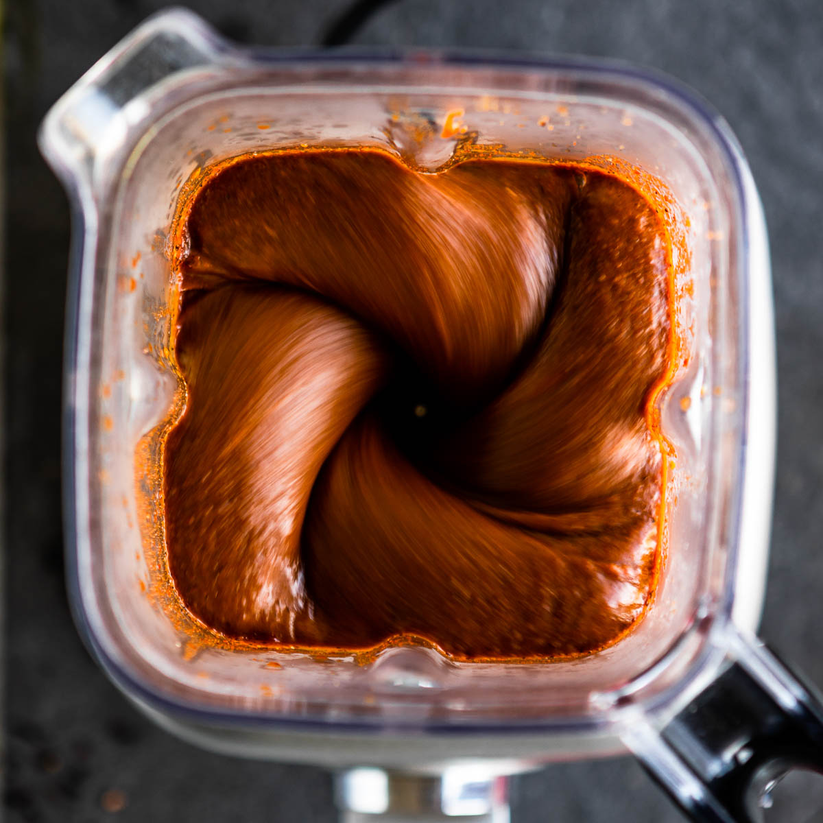Chamoy sauce blending in a blender on high speed.