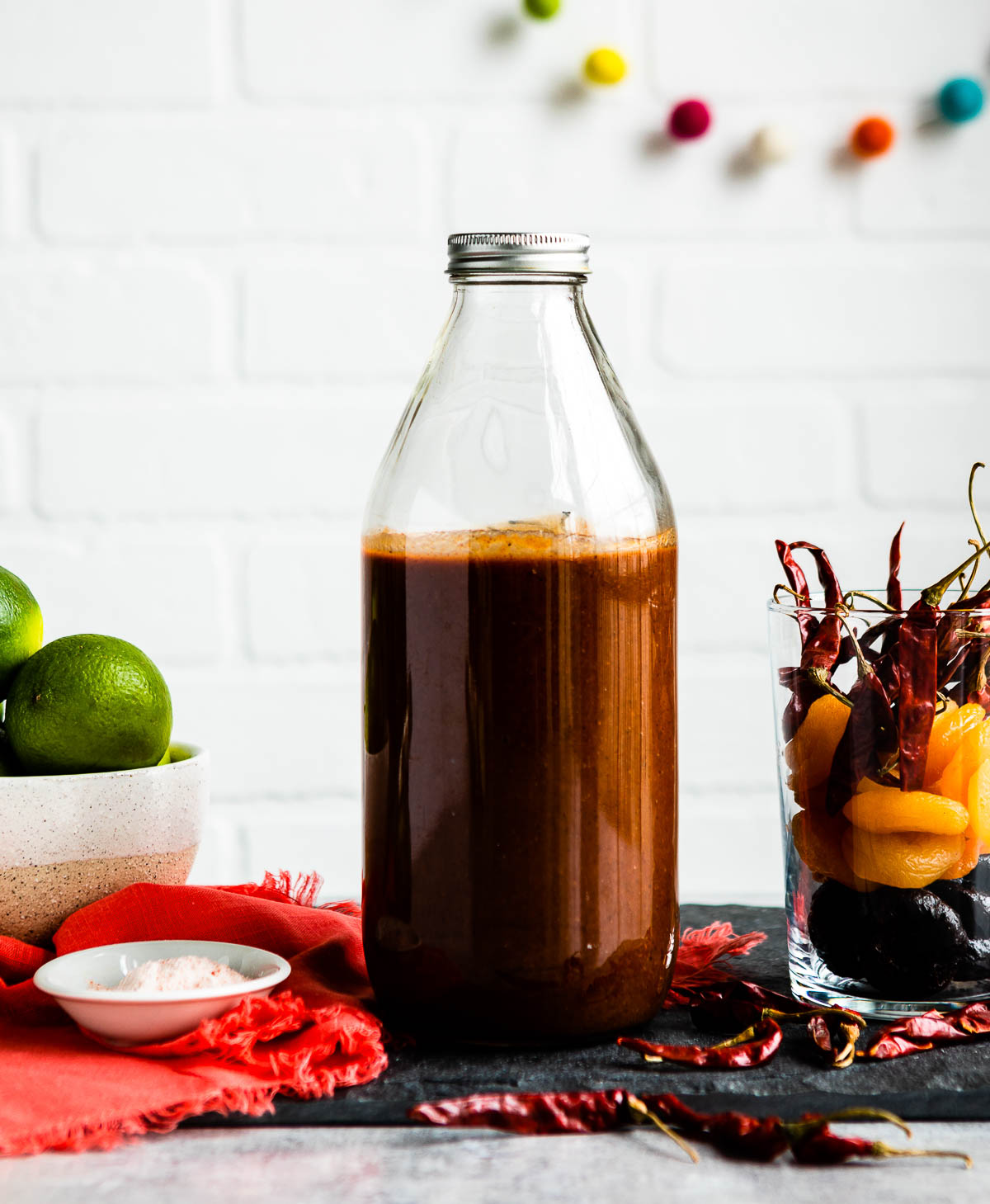 Homemade chamoy sauce in glass jar with screw lid.