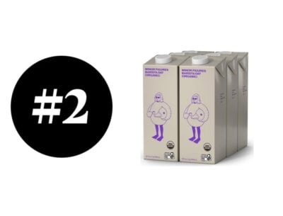 Three cartons of Minor Figures organic oat milk with a black #2 circle.