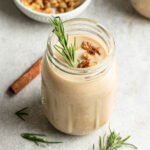 Glass with healthy vanilla protein shake recipe in it.