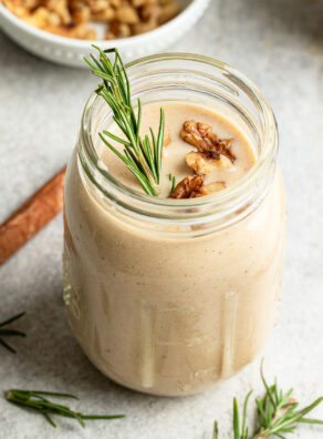 Glass with healthy vanilla protein shake recipe in it.