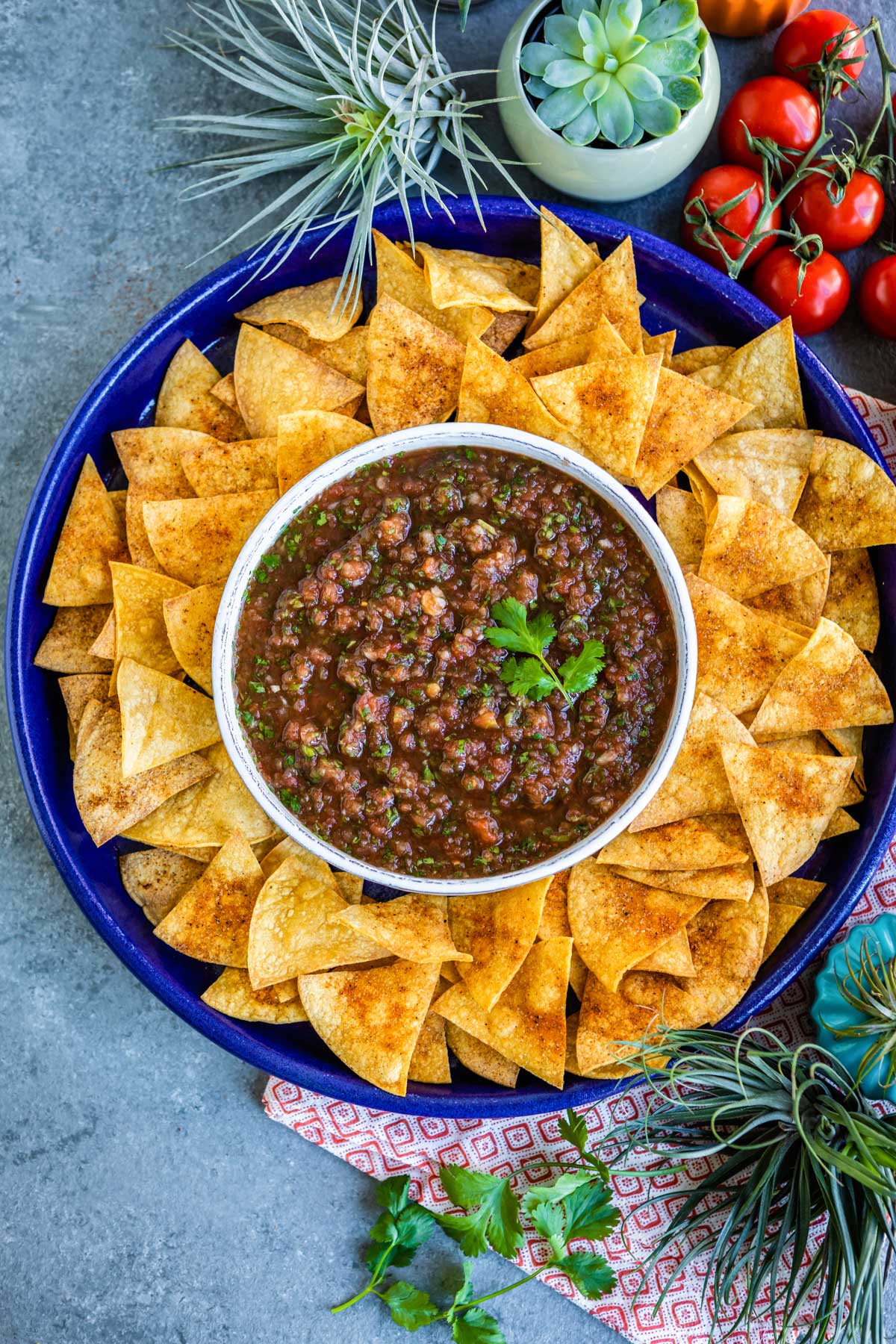 bowl of blender salsa surrounded by chips