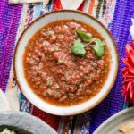 blender salsa in bowl with cilantro